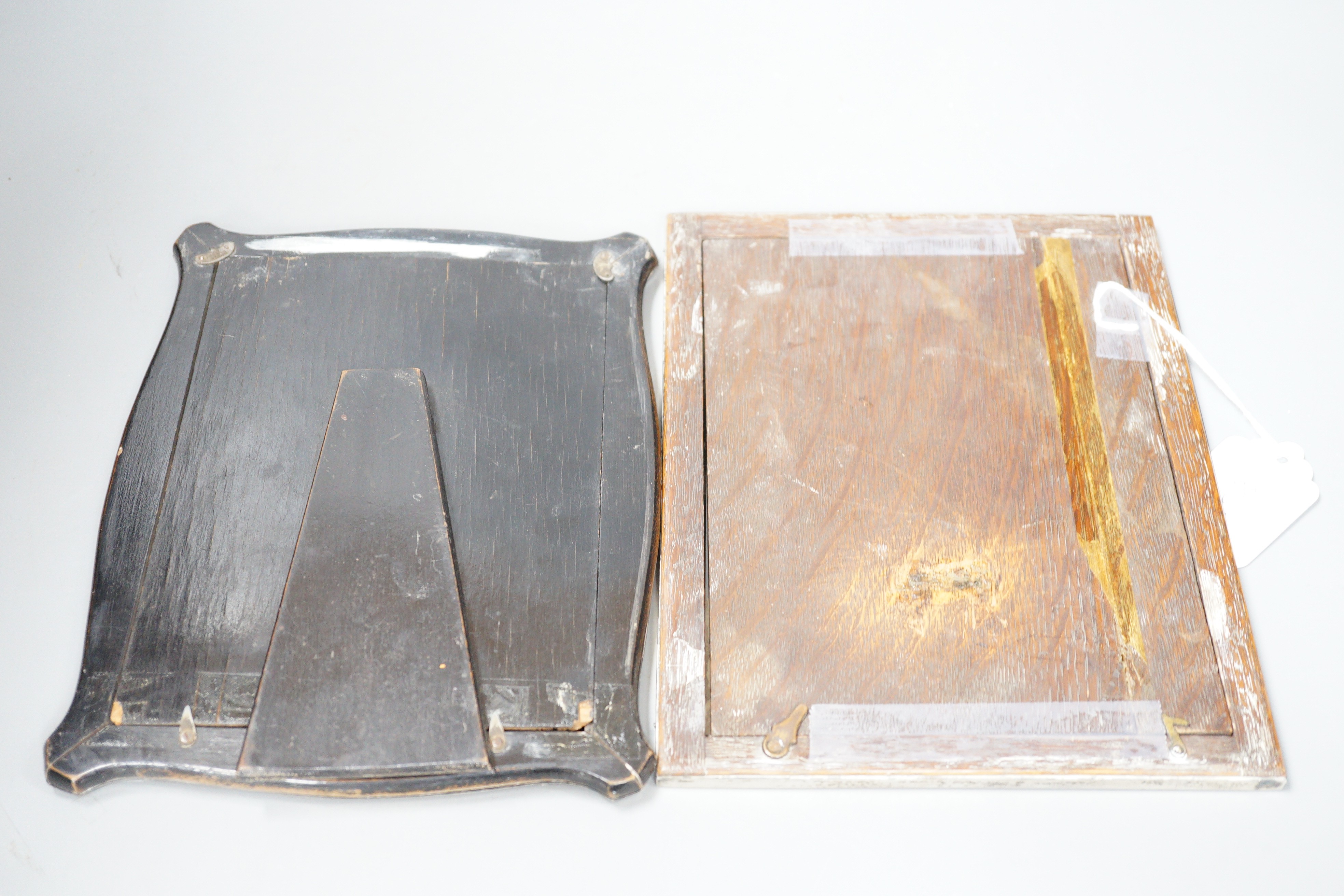 A George V silver mounted rectangular photograph frame, Chester 1922, 23.6cm and a shaped rectangular silver mounted photograph frame, Birmingham, 1912.